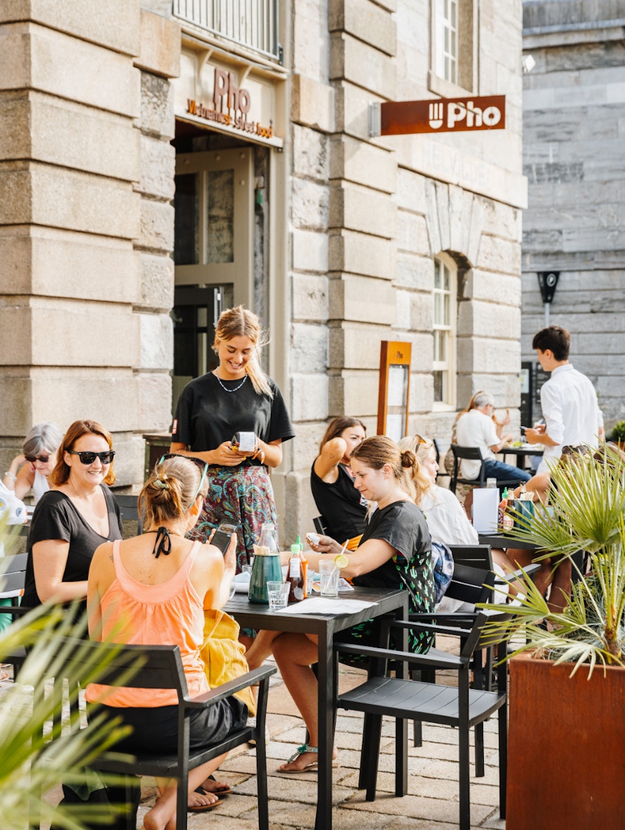 Waitress taking an order outside pho